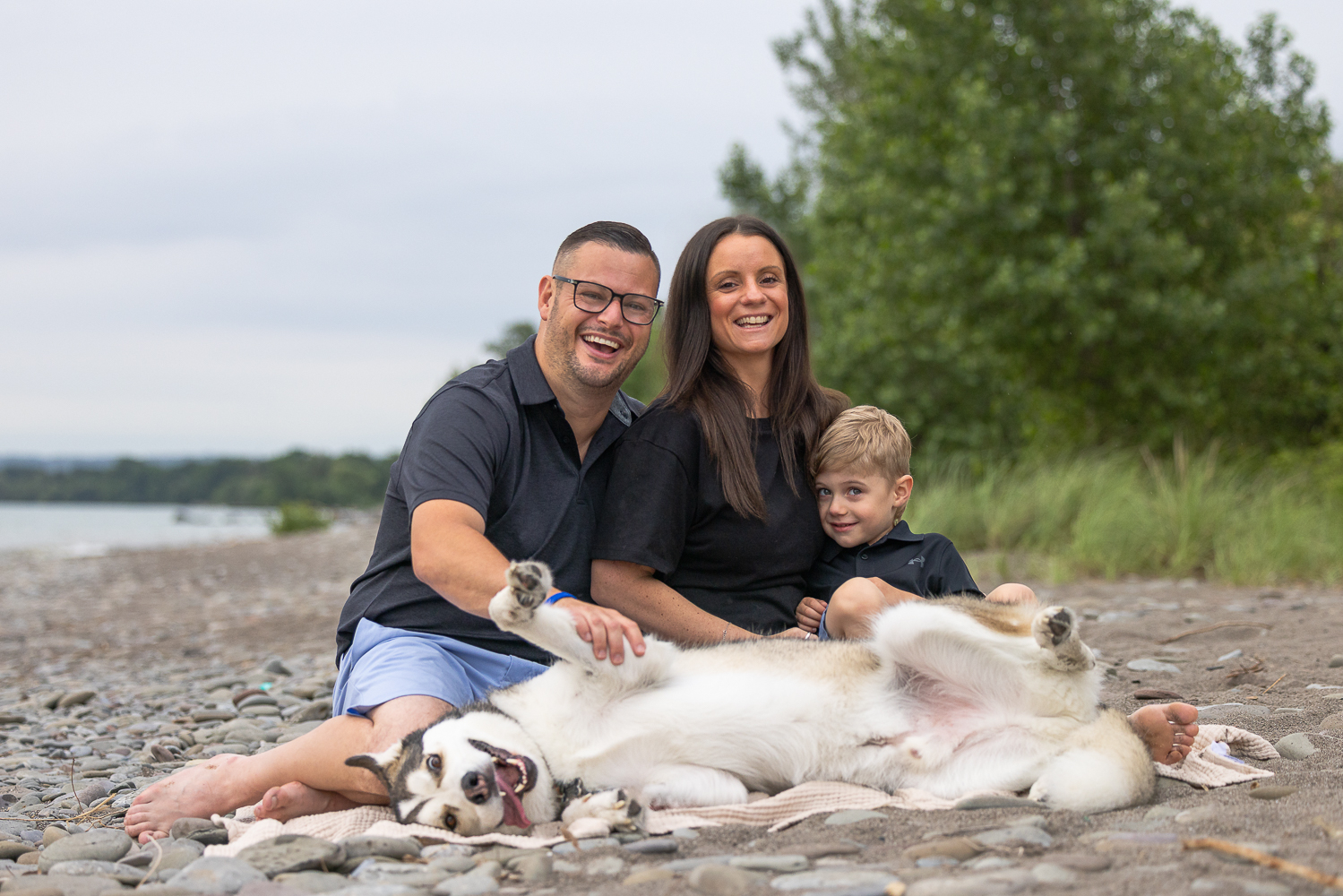 a dog and family beach photoshoot session